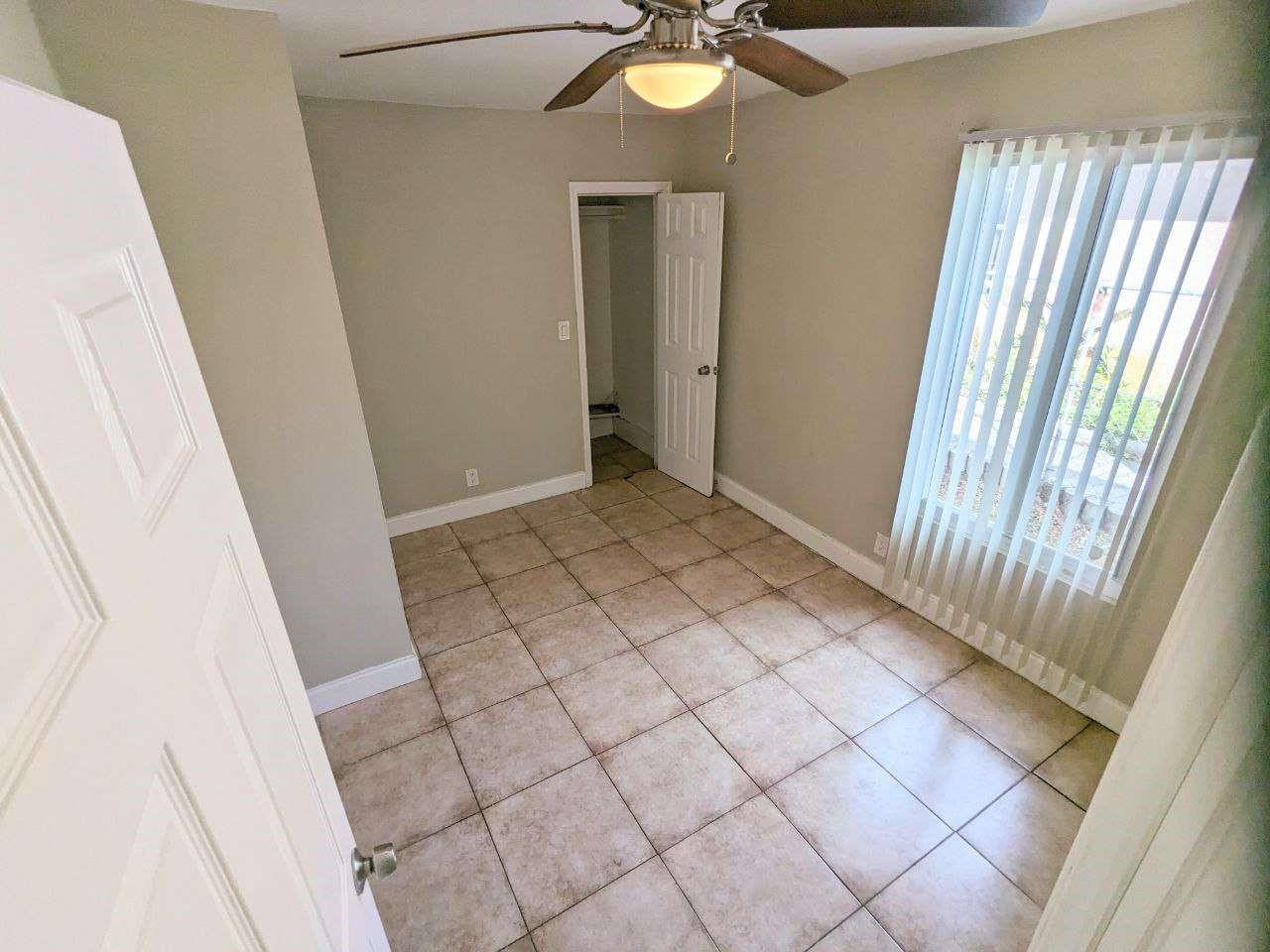 141 Northwest 10th Street Pompano Beach, FL 33060 - Photo 11 of 24 a view of an empty room and wooden floor