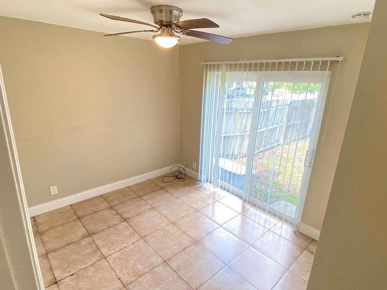 141 Northwest 10th Street Pompano Beach, FL 33060 - Photo 22 of 24 a view of an empty room with a window