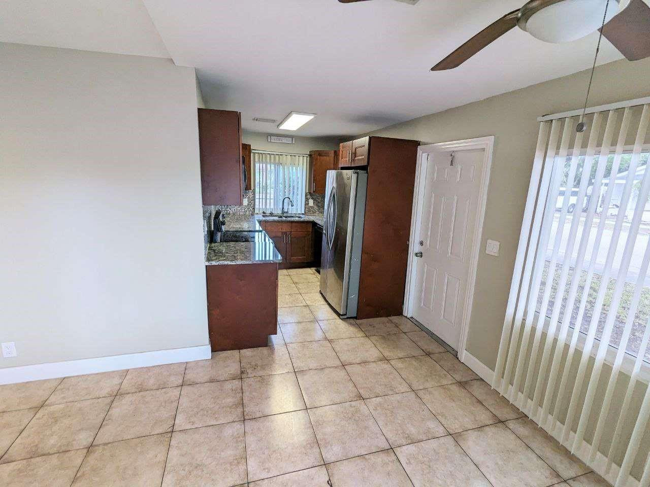 141 Northwest 10th Street Pompano Beach, FL 33060 - Photo 6 of 24 a view of a storage & utility room with a window