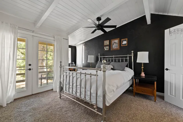 a bed room with a bed and a window