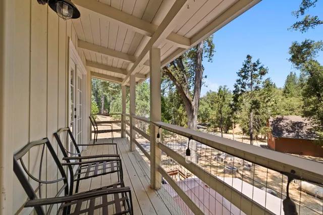 a view of a two chairs in the balcony