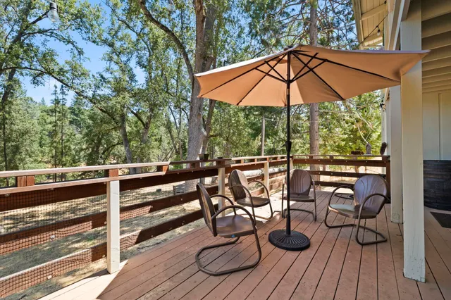 a view of balcony with chairs and wooden floor