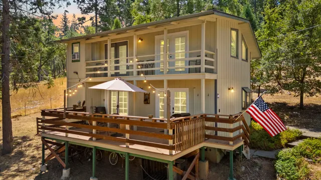 a view of a patio with table and chairs and potted plants