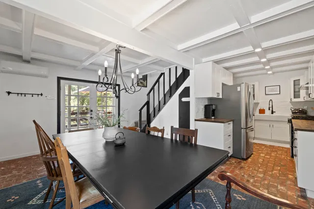 a view of a dining room and livingroom with furniture