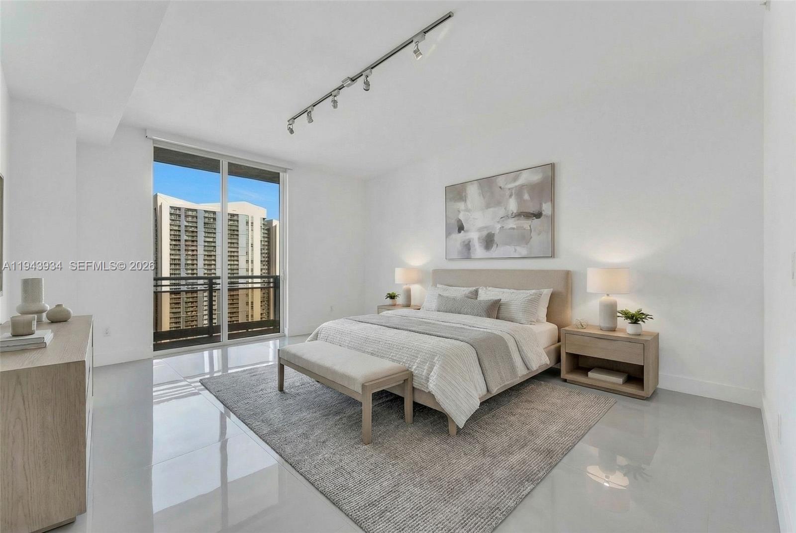 901 Brickell Key Boulevard, Unit 3206 Miami, FL 33131 - Photo 14 of 41 a bed room with a bed and a window