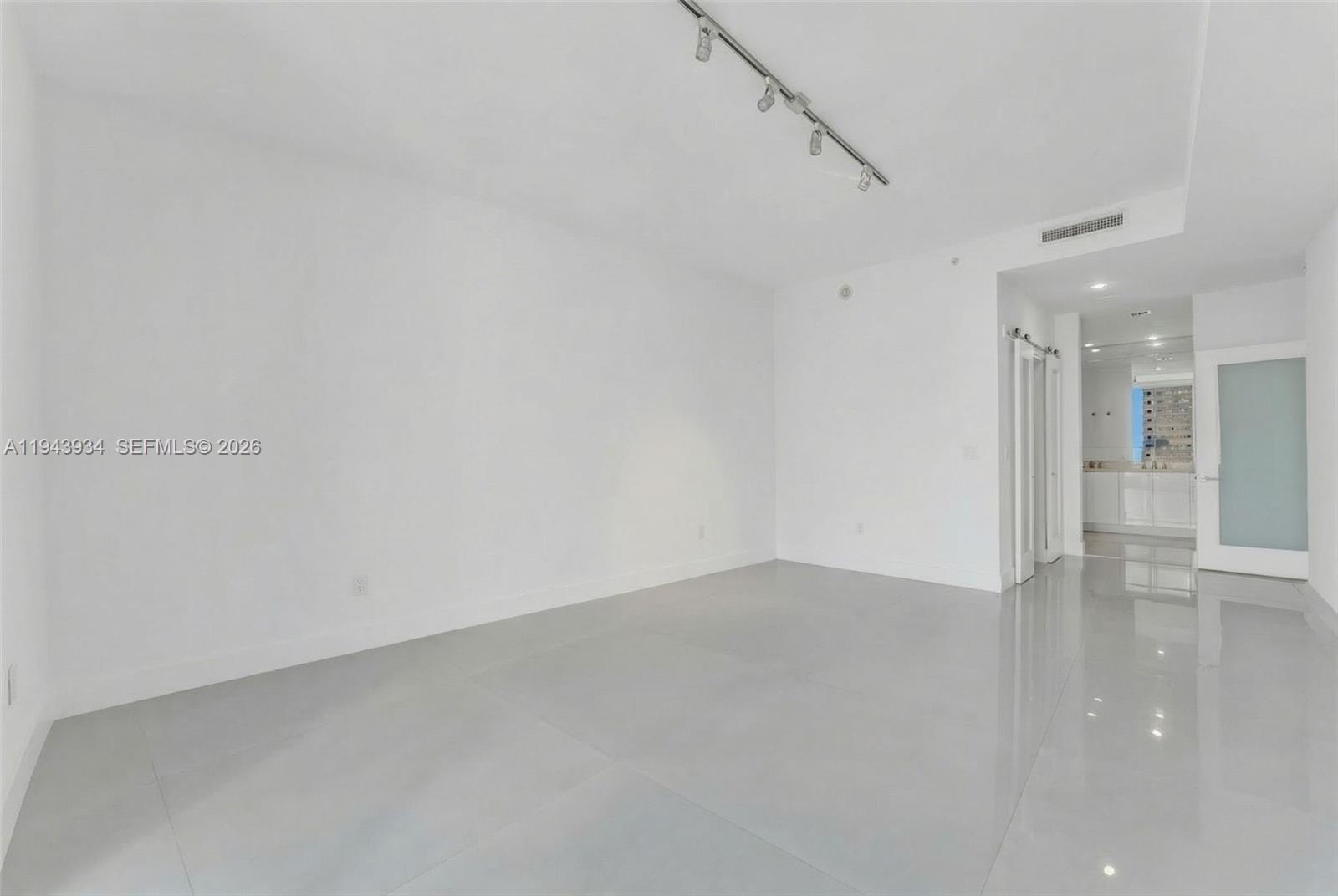 901 Brickell Key Boulevard, Unit 3206 Miami, FL 33131 - Photo 17 of 41 a view of an empty room