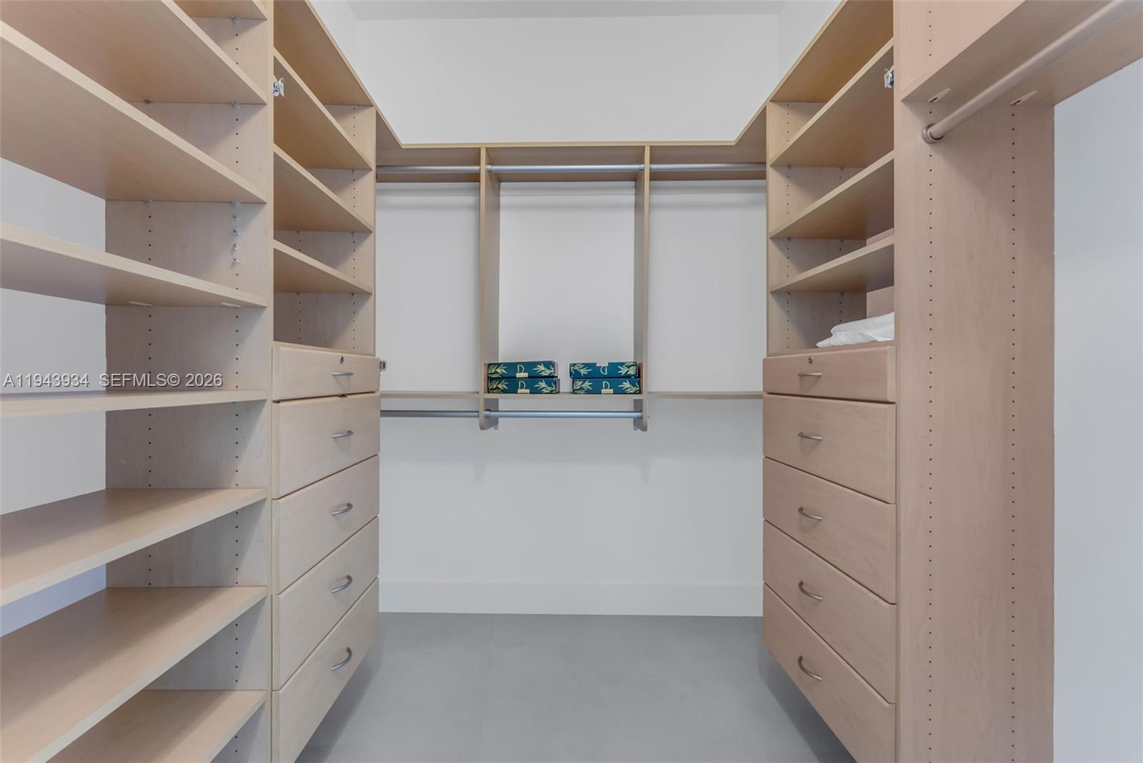 901 Brickell Key Boulevard, Unit 3206 Miami, FL 33131 - Photo 18 of 41 a view of walk in closet with empty racks