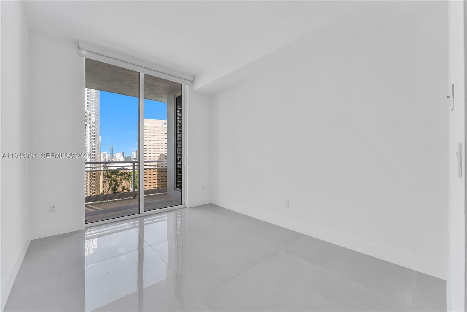 901 Brickell Key Boulevard, Unit 3206 Miami, FL 33131 - Photo 21 of 41 wooden floor in an empty room