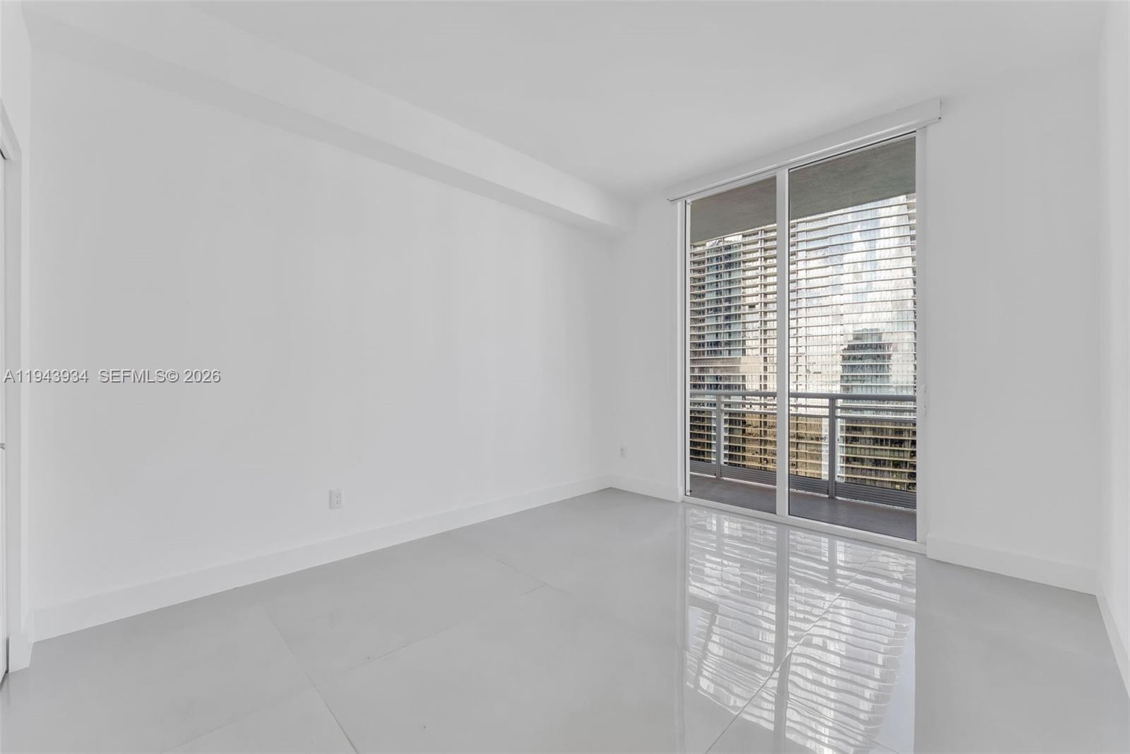 901 Brickell Key Boulevard, Unit 3206 Miami, FL 33131 - Photo 27 of 41 a view of an empty room with a window