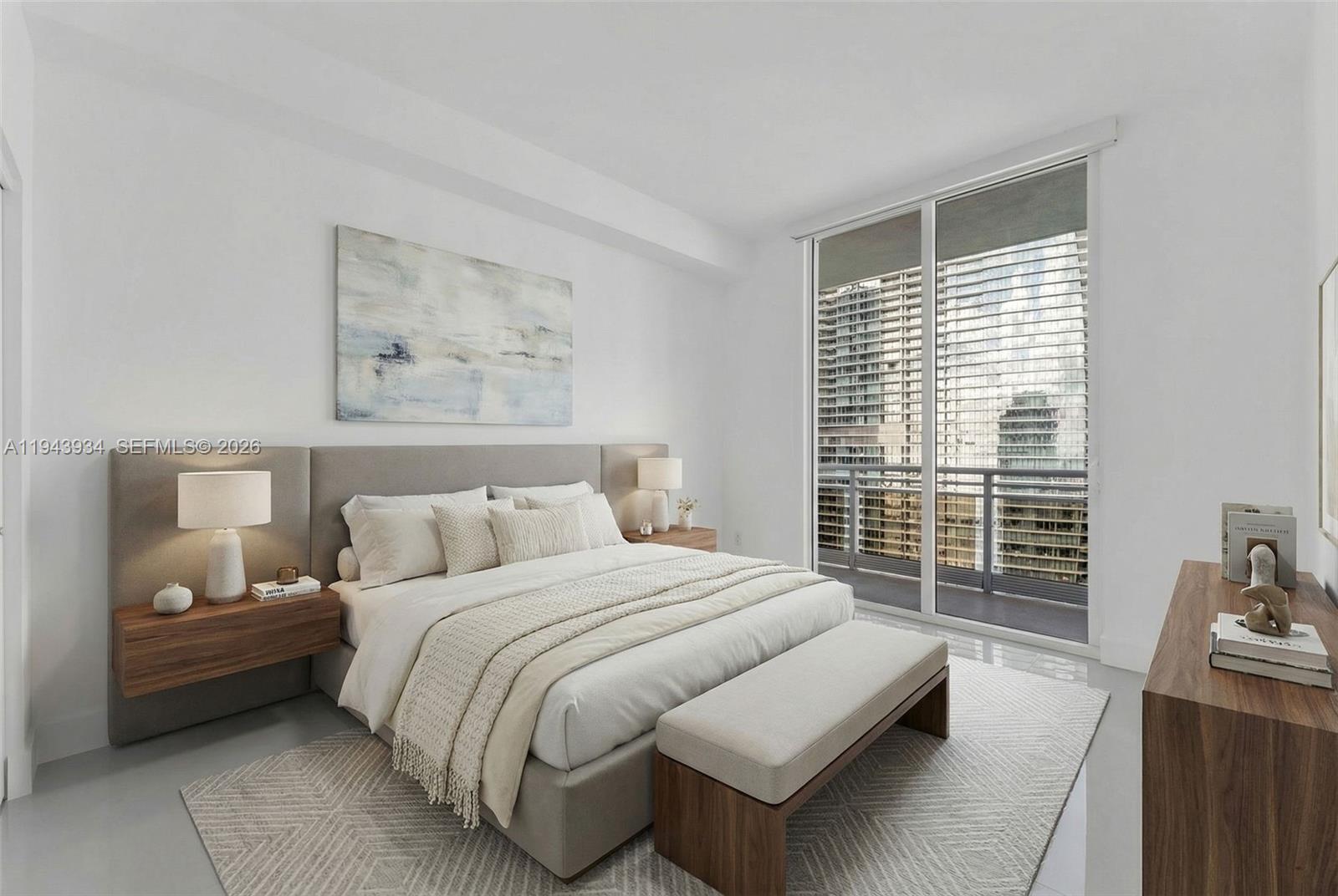 901 Brickell Key Boulevard, Unit 3206 Miami, FL 33131 - Photo 28 of 41 a bedroom with a bed a couch and next to a window