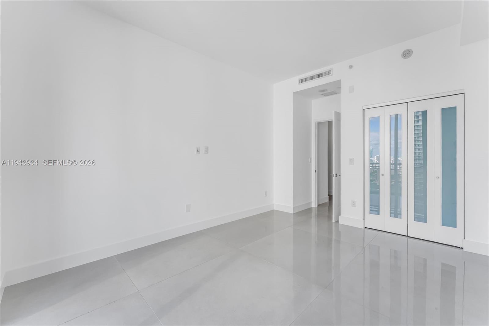 901 Brickell Key Boulevard, Unit 3206 Miami, FL 33131 - Photo 29 of 41 a view of an empty room