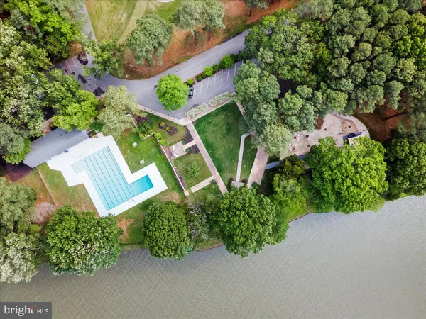 an aerial view of a house with a yard and outdoor space
