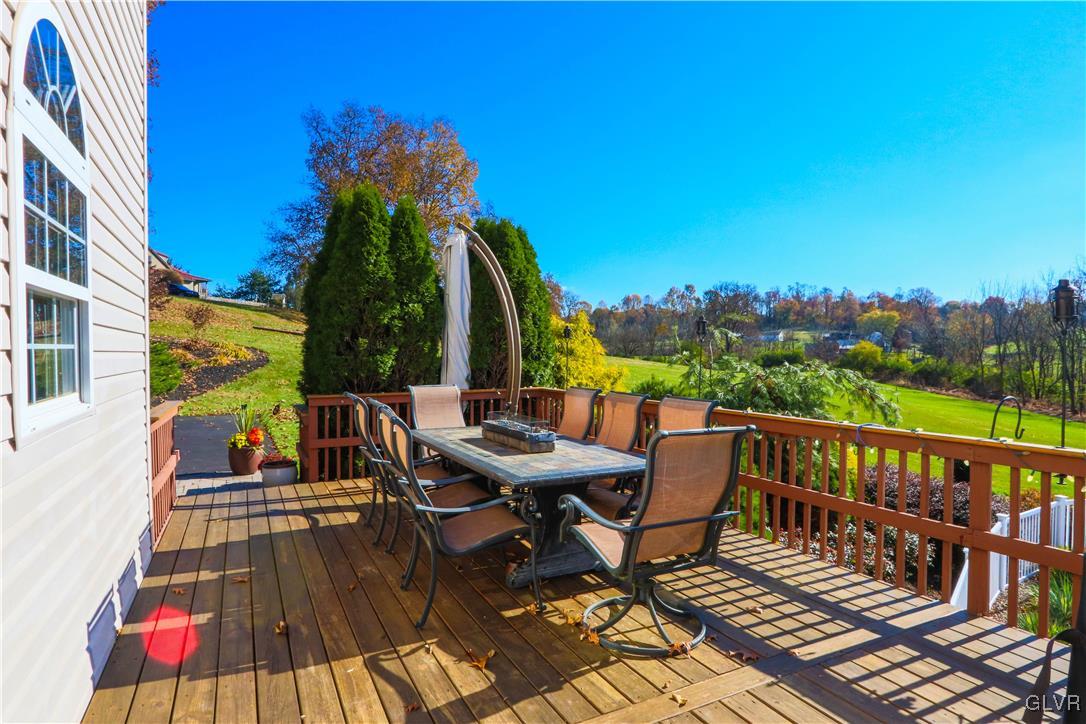 136 Starr Road Reading, PA 19608 - Photo 11 of 45 a view of a roof deck with table and chairs a barbeque with wooden floor and fence