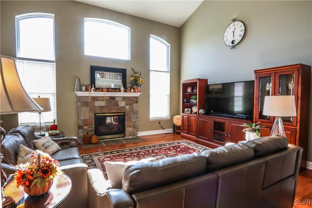 136 Starr Road Reading, PA 19608 - Photo 13 of 45 a living room with furniture a flat screen tv and a fireplace