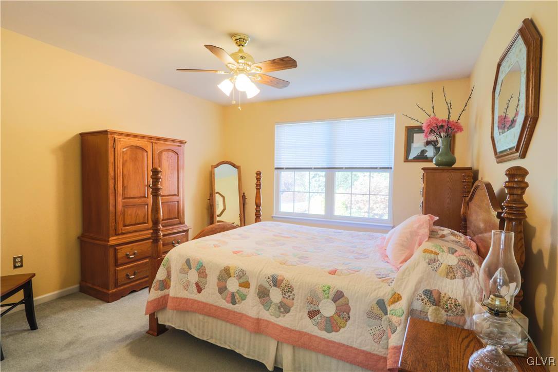 136 Starr Road Reading, PA 19608 - Photo 22 of 45 a bedroom with a bed and a chandelier