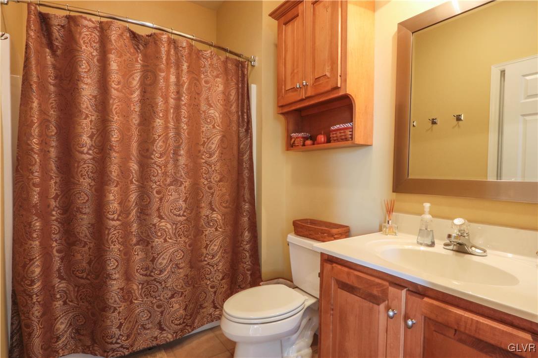 136 Starr Road Reading, PA 19608 - Photo 6 of 45 a bathroom with a granite countertop sink and a mirror