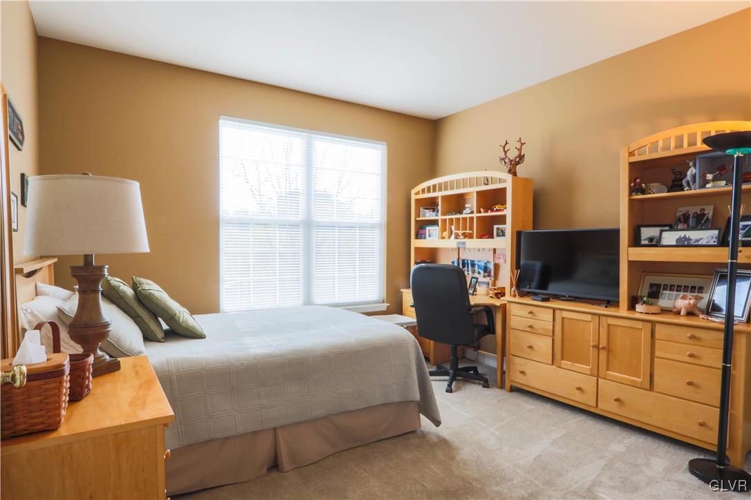 136 Starr Road Reading, PA 19608 - Photo 7 of 45 a bedroom with a bed and flat screen tv