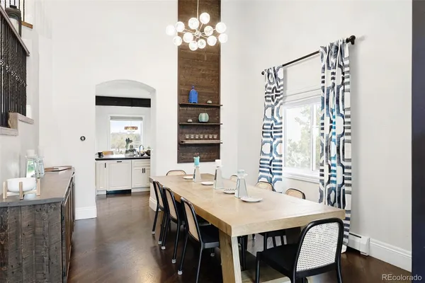 a bed room with a bed a couch and a window