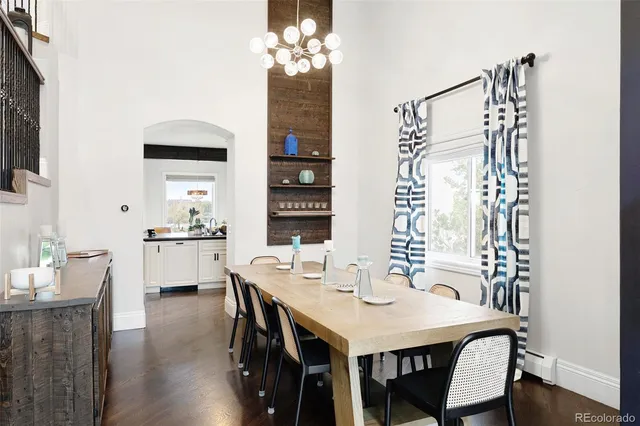 a bed room with a bed a couch and a window