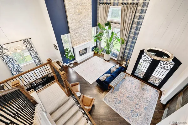 a living room with fireplace furniture and a flat screen tv