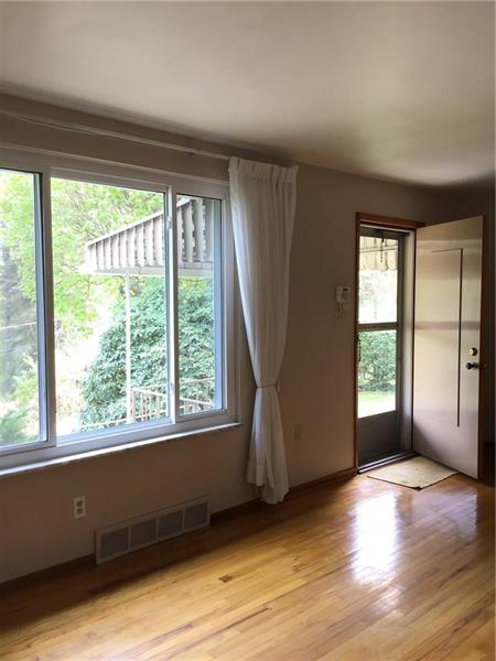 1606 Lafayette Road Pittsburgh, PA 15221 - Photo 3 of 25 Brand new windows filter in plenty of natural light.