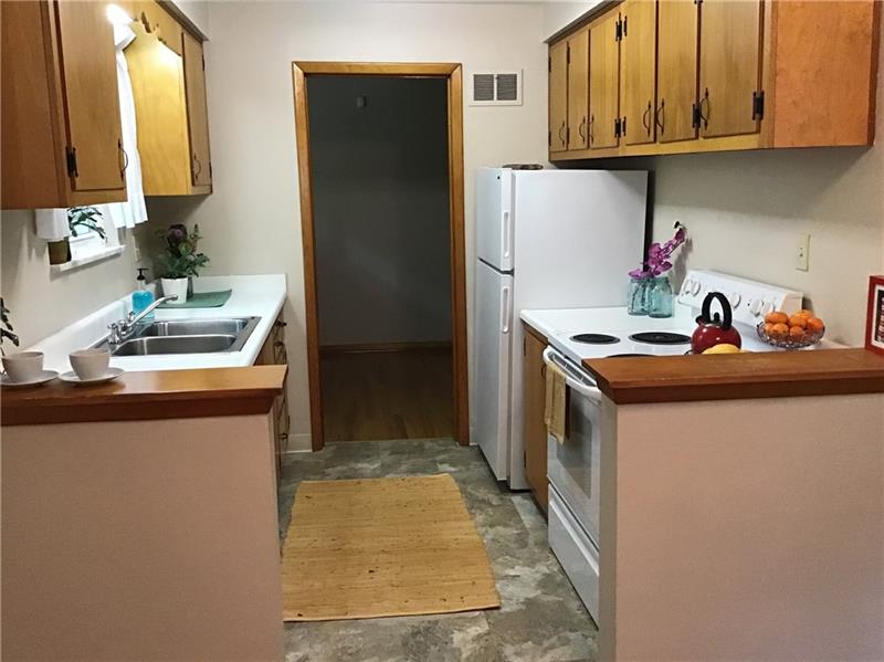 1606 Lafayette Road Pittsburgh, PA 15221 - Photo 9 of 25 The galley kitchen is clean, upgraded, and ergonomic.