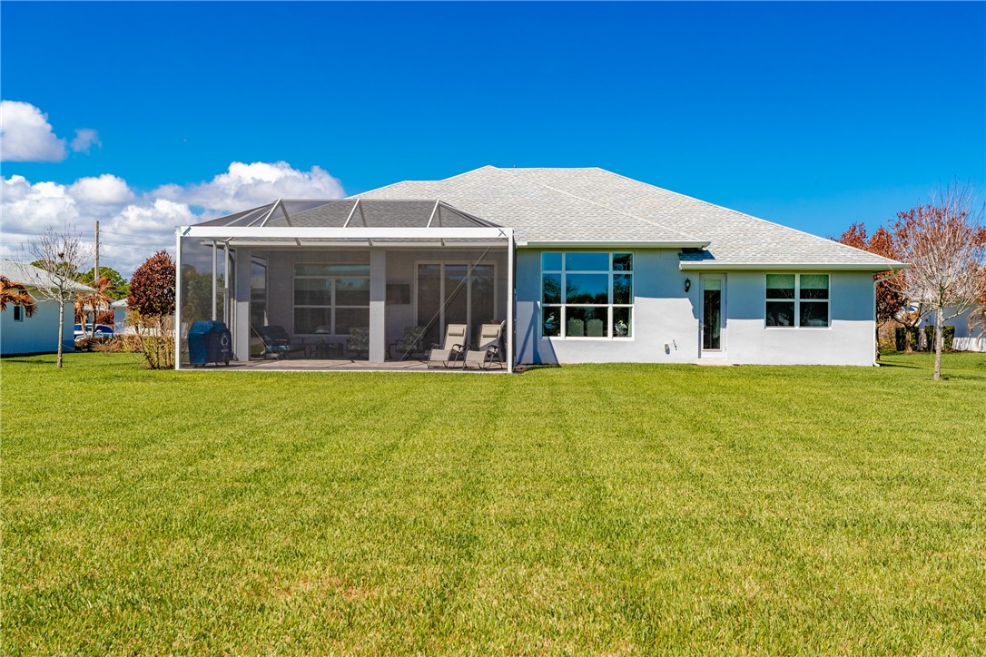 105 Night Hawk Way Sebastian, FL 32958 - Photo 33 of 36 a view of a house with a backyard patio and swimming pool