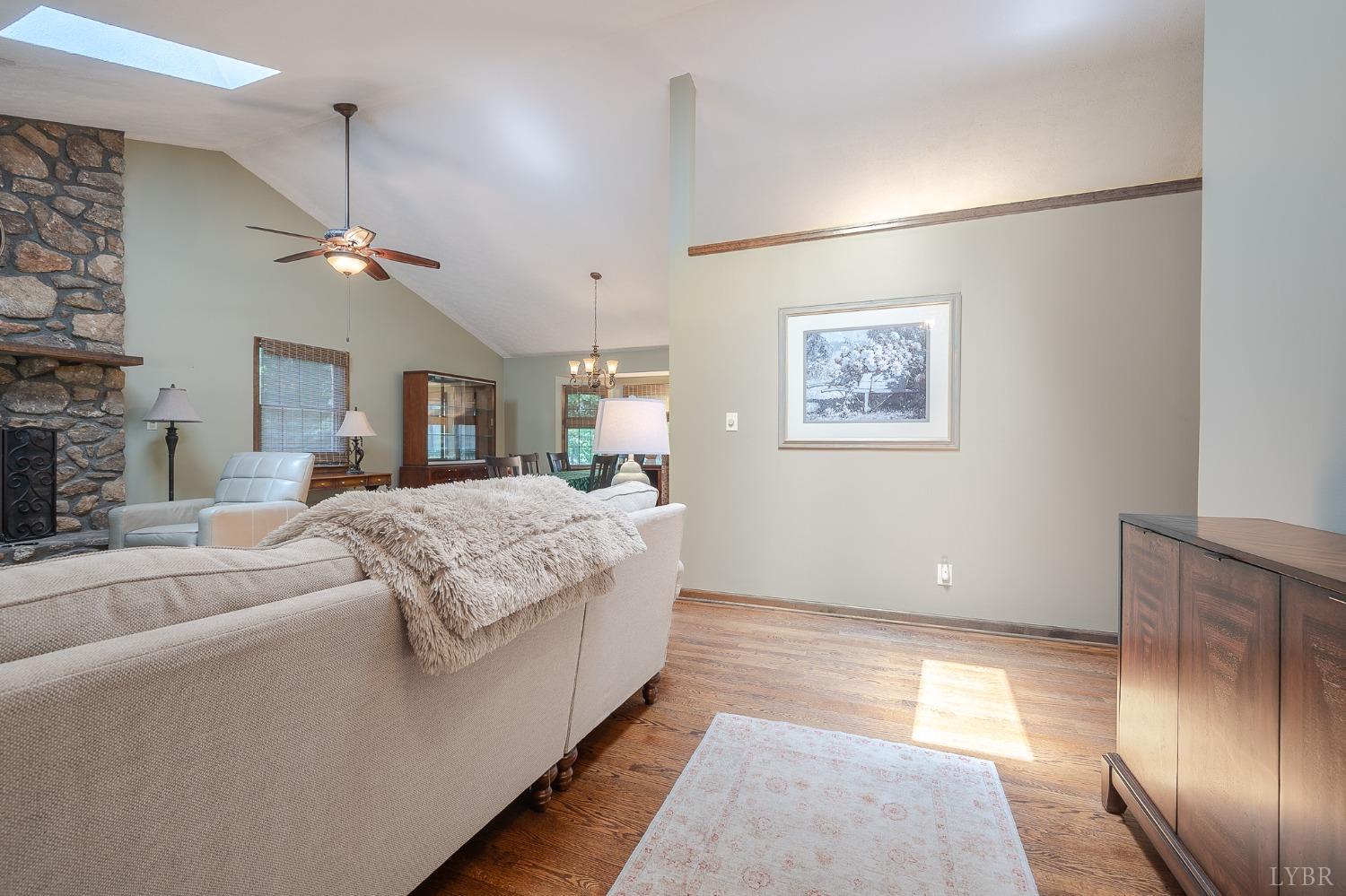 136 Guffey Terrace Lynchburg, VA 24502 - Photo 4 of 33 a spacious bedroom with a large bed and a chandelier
