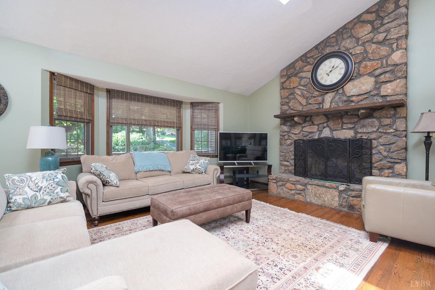 136 Guffey Terrace Lynchburg, VA 24502 - Photo 6 of 33 a living room with furniture a large window and a fireplace