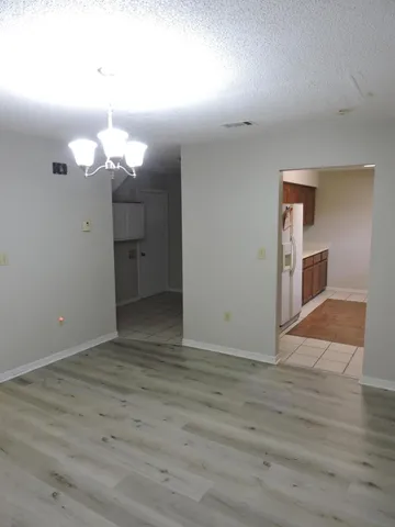 a view of a livingroom with wooden floor
