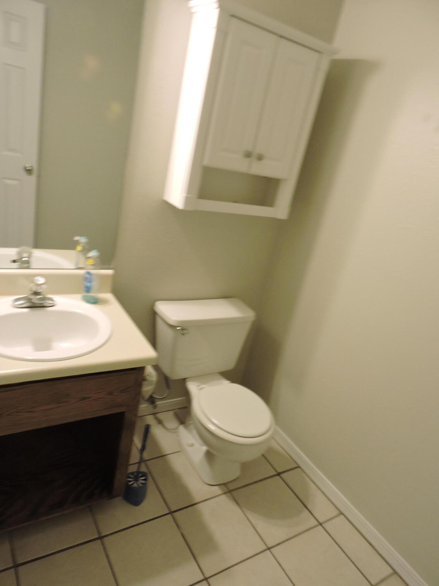 813 Valley Road Crestview, FL 32539 - Photo 10 of 18 a bathroom with a sink a toilet and a mirror