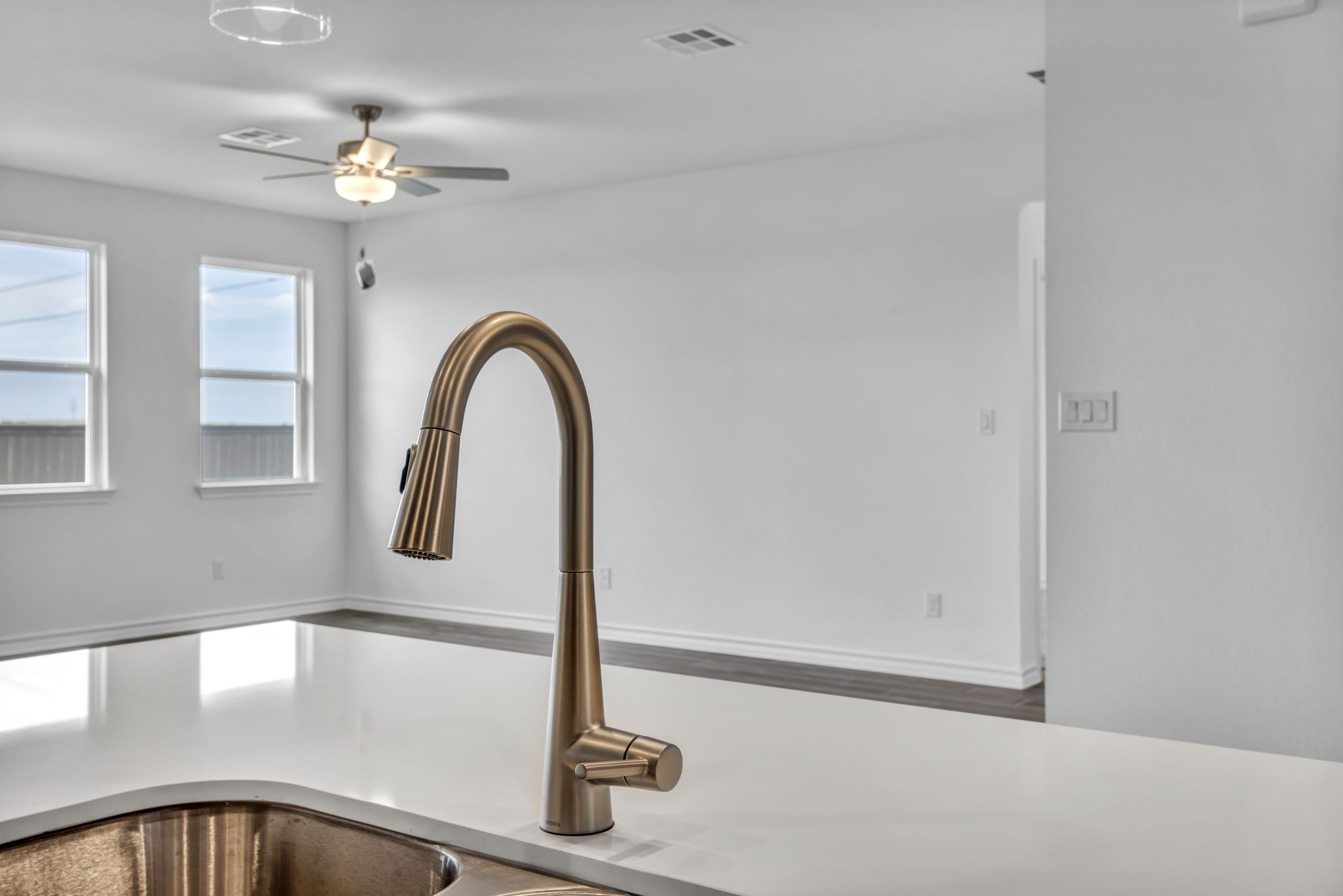 131 Adeline Road Hutto, TX 78634 - Photo 19 of 30 A modern kitchen faucet and sink provide a sleek focal point within this luminous, open-concept living space.