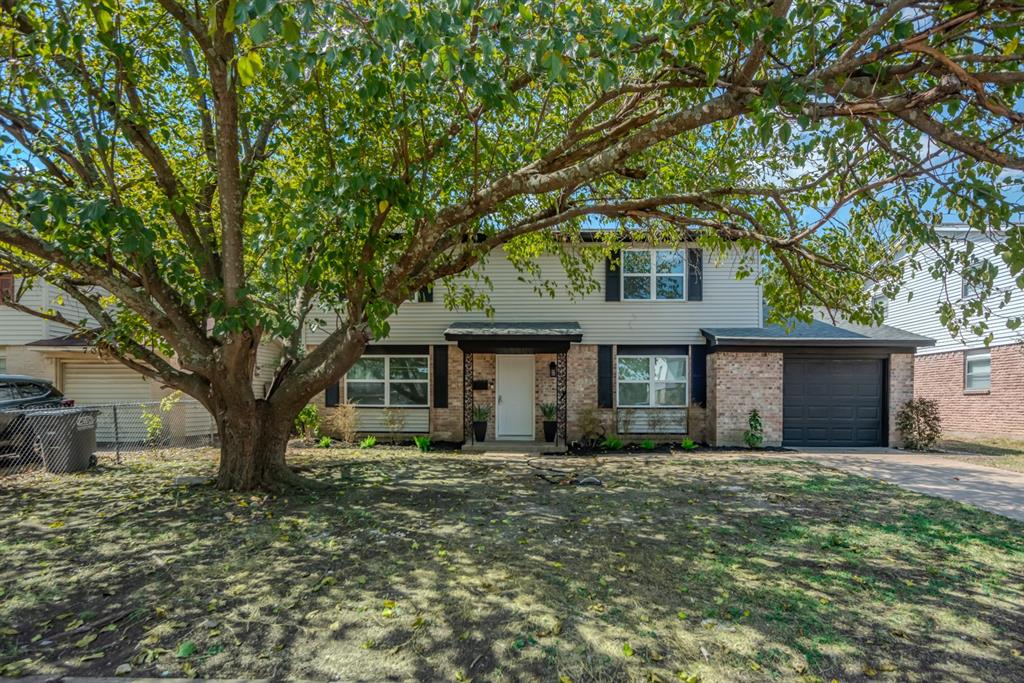 716 Rutgers Drive Lancaster, TX 75134 - Photo 1 of 1 View of front of property with a garage and driveway