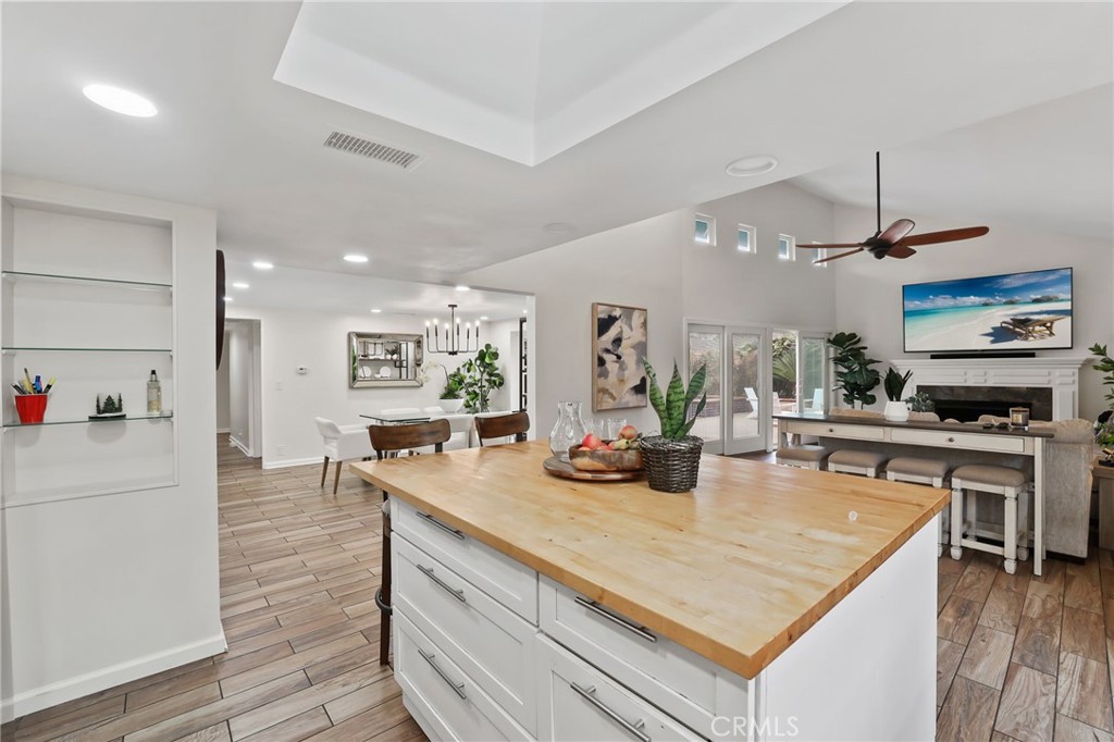 11731 Wembley Road Rossmoor, CA 90720 - Photo 18 of 51 a kitchen with stainless steel appliances granite countertop a stove and a refrigerator