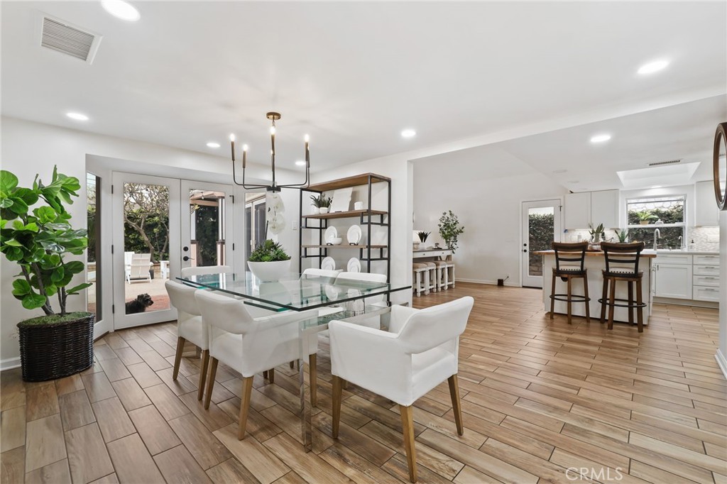 11731 Wembley Road Rossmoor, CA 90720 - Photo 20 of 51 a view of a dining room with furniture