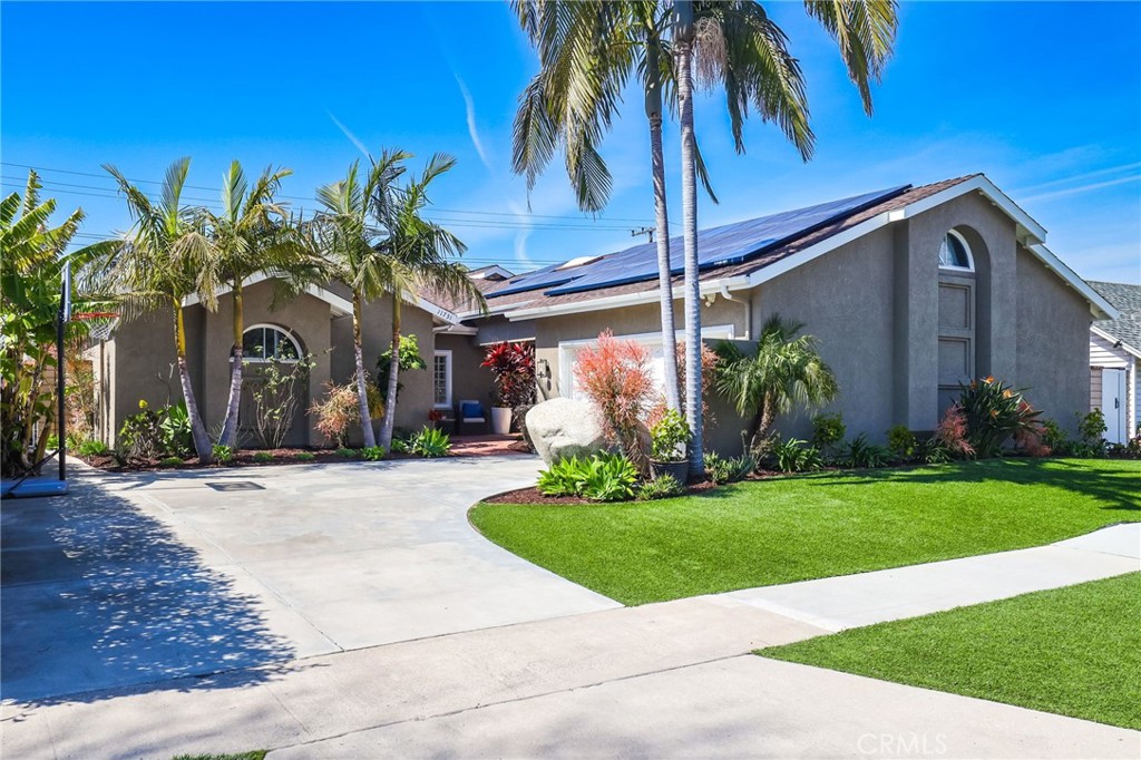 11731 Wembley Road Rossmoor, CA 90720 - Photo 2 of 51 a front view of a house with garden