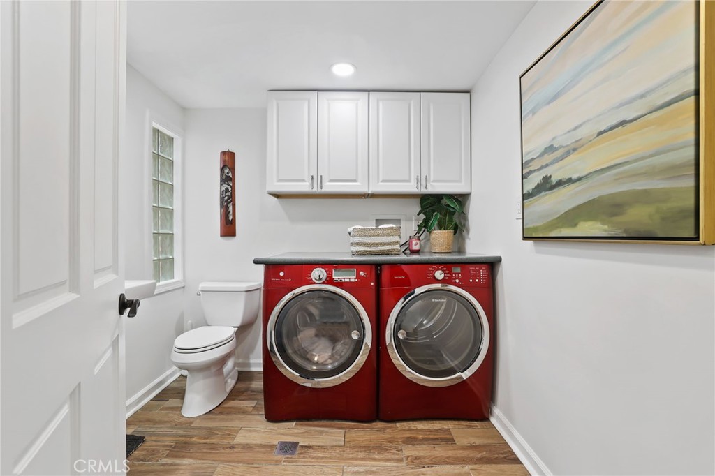 11731 Wembley Road Rossmoor, CA 90720 - Photo 21 of 51 a view of a storage and utility room with washer and dryer