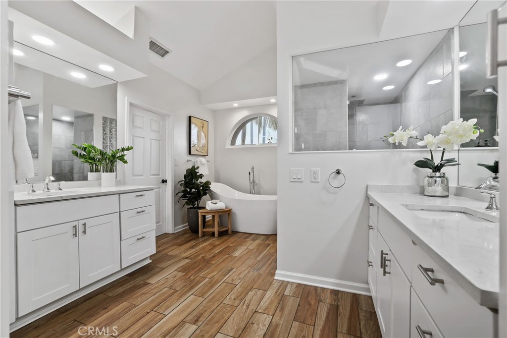11731 Wembley Road Rossmoor, CA 90720 - Photo 24 of 51 a spacious bathroom with a sink double vanity granite and a mirror