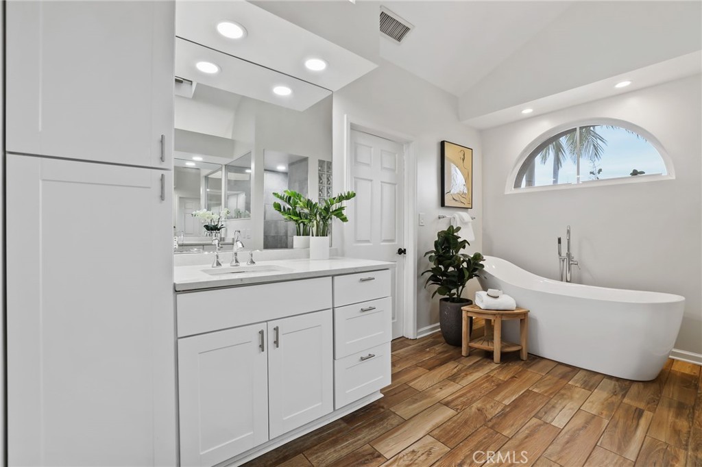 11731 Wembley Road Rossmoor, CA 90720 - Photo 25 of 51 a bathroom with a sink and a mirror