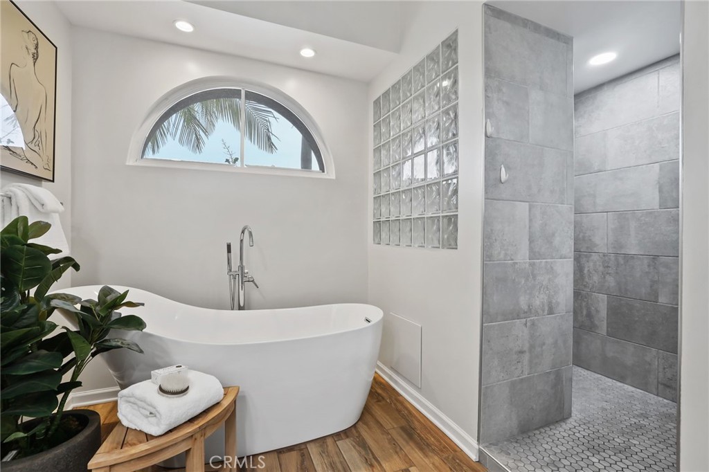 11731 Wembley Road Rossmoor, CA 90720 - Photo 26 of 51 a living room with furniture and a potted plant