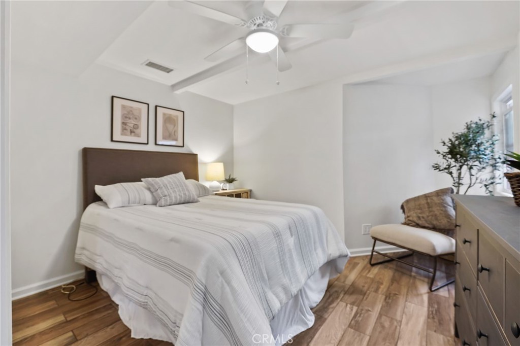 11731 Wembley Road Rossmoor, CA 90720 - Photo 27 of 51 a bedroom with bed and a couch