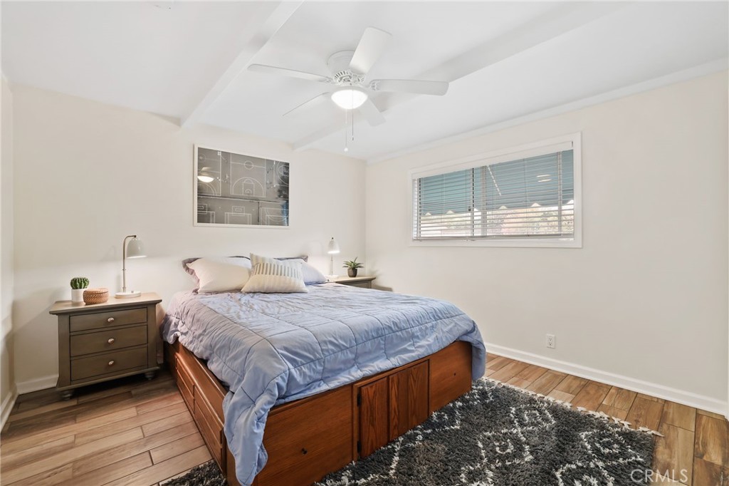 11731 Wembley Road Rossmoor, CA 90720 - Photo 28 of 51 a bedroom with a bed and a window