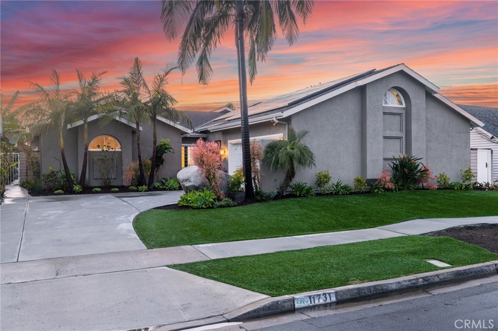 11731 Wembley Road Rossmoor, CA 90720 - Photo 35 of 51 a front view of house with a garden