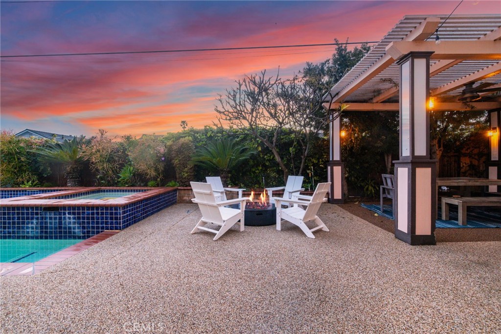 11731 Wembley Road Rossmoor, CA 90720 - Photo 36 of 51 a view of a patio with a table and chairs