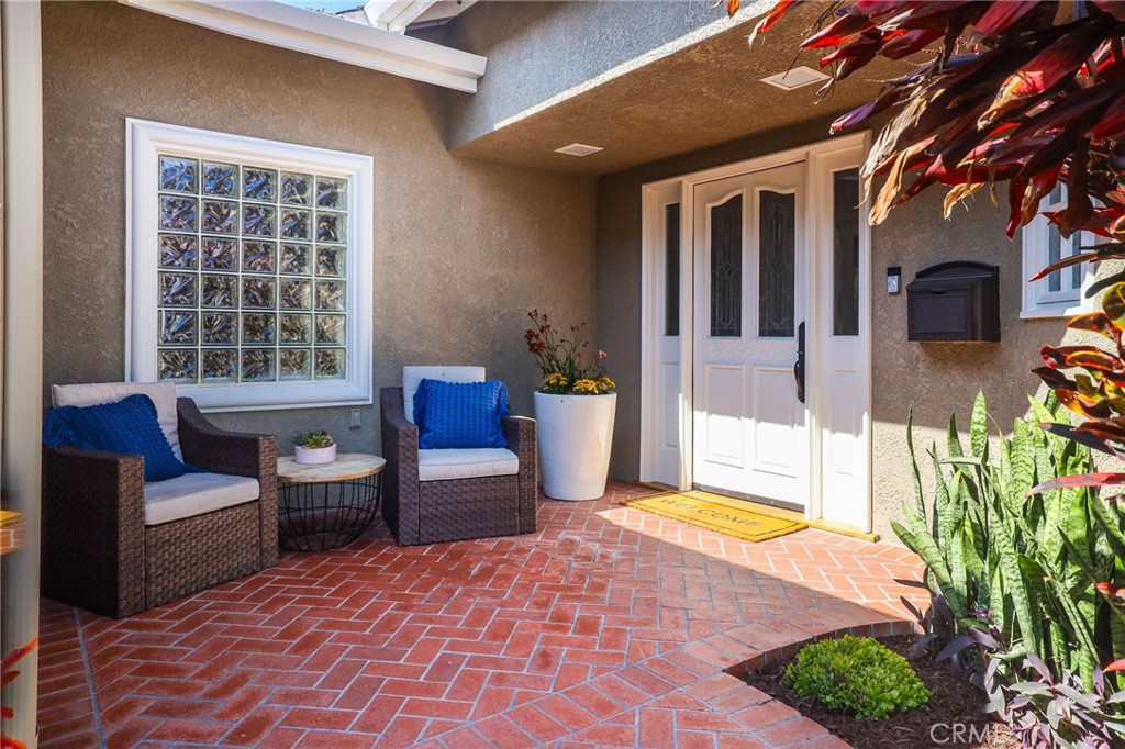 11731 Wembley Road Rossmoor, CA 90720 - Photo 4 of 51 a view of a house with swimming pool and sitting area