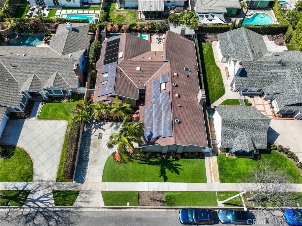 11731 Wembley Road Rossmoor, CA 90720 - Photo 46 of 51 an aerial view of a house with a garden and large trees