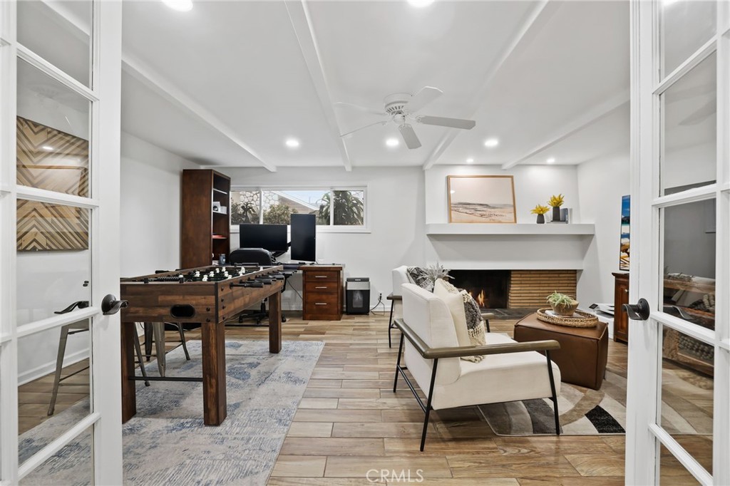 11731 Wembley Road Rossmoor, CA 90720 - Photo 7 of 51 a living room with furniture a dining table and a piano