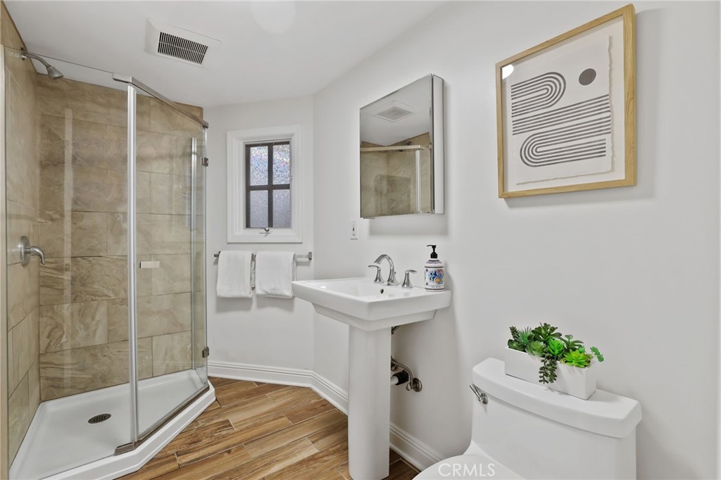 11731 Wembley Road Rossmoor, CA 90720 - Photo 10 of 51 a bathroom with a sink toilet and shower
