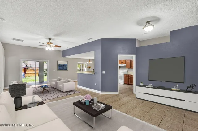 a living room with furniture and a flat screen tv