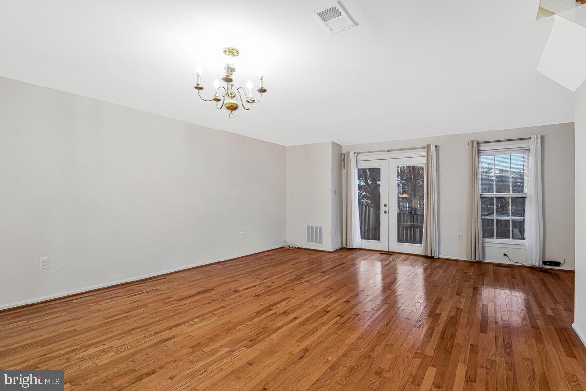 7865 Parthian Court Springfield, VA 22153 - Photo 13 of 40 wooden floor in an empty room with a window